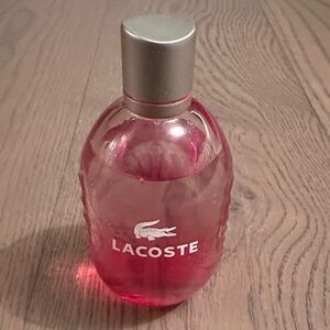 Lacoste Pink Bottle with Silver Lid men’s cologne